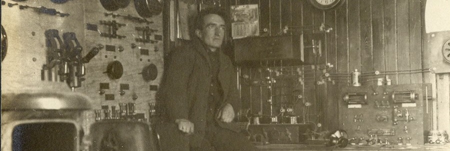 VAE in early the 1910's.  Spark transmitter controls on the wall to the left, and the receiving apparatus on the desk to the right. (Bowerman photo)